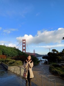 Huong poses with the Golden Gate Bridge in the background